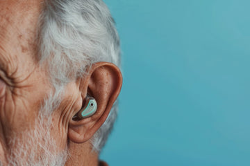 senior man wearing modern hearing aid