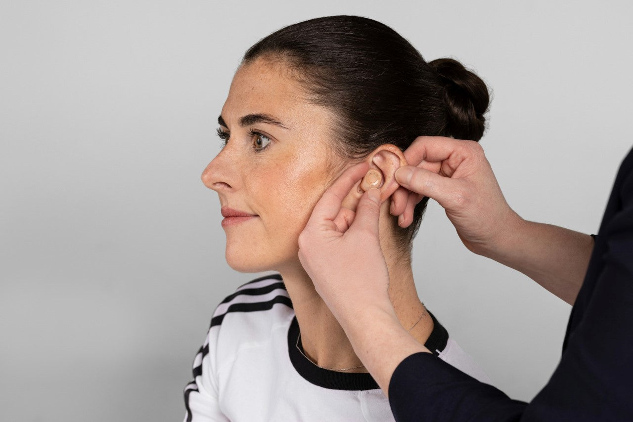 beautiful woman wearing hearing aids